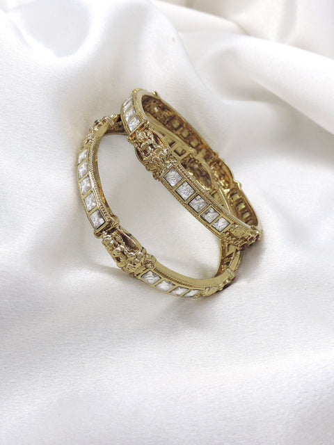 White stone temple bangle set with gold-tone detailing by Joyrias