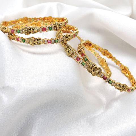 Multicolor temple bangle set with pink and green stones by Joyrias