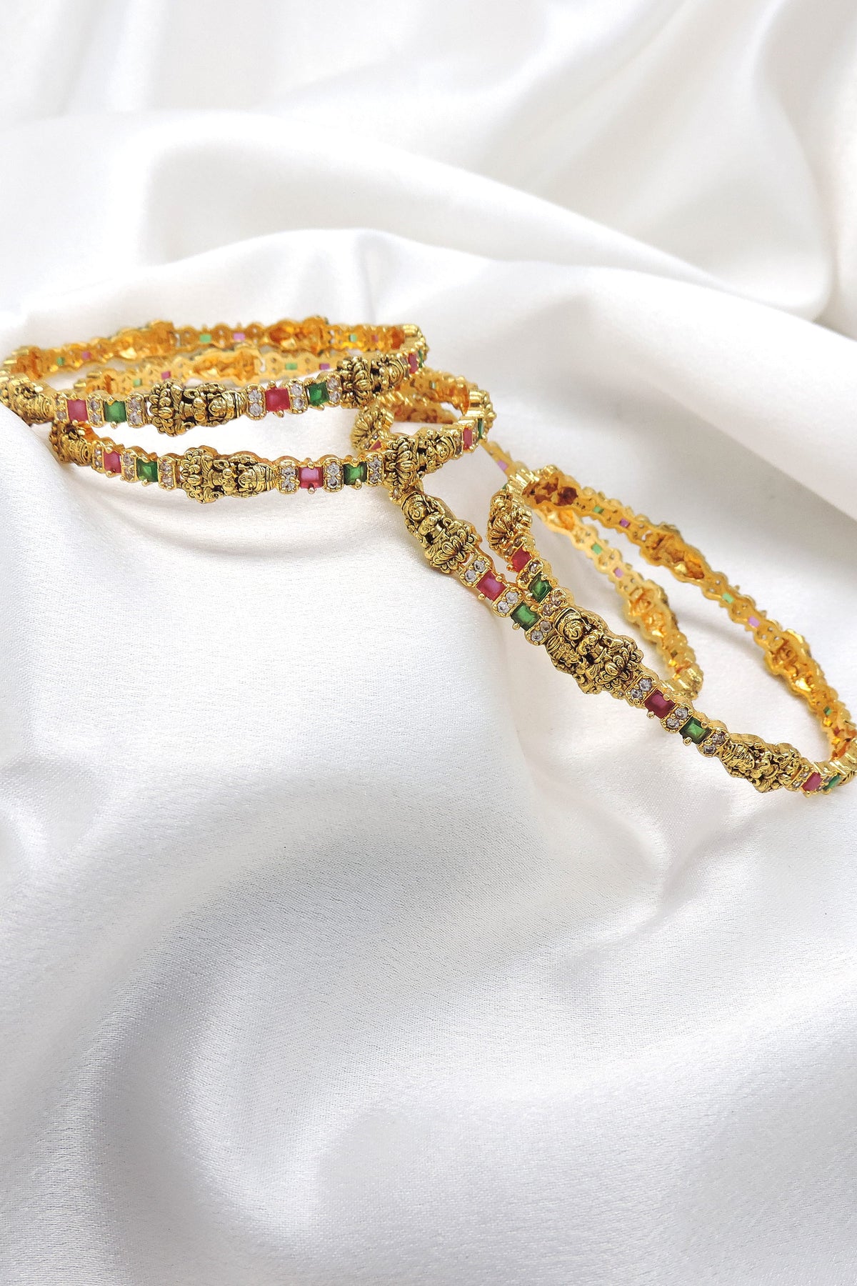 Multicolor temple bangle set with pink and green stones by Joyrias