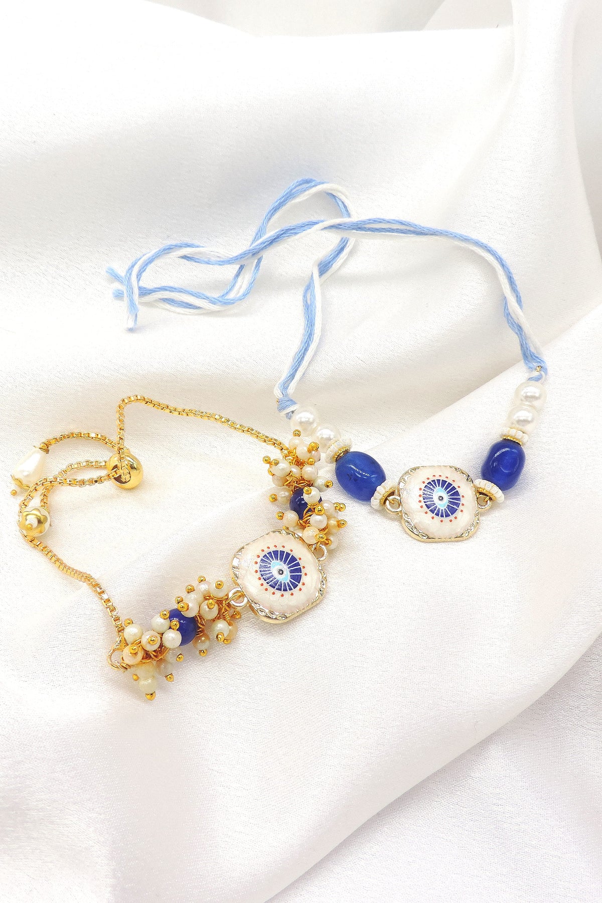 Evil eye enamel pearl bhaiya bhabhi rakhi set by Joyrias