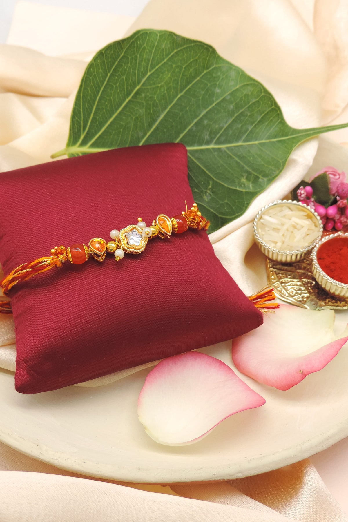Designer Kundan Rakhi with Orange Crystal Beads