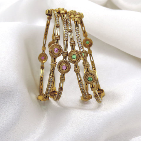 Refined gold-toned multicolor AD bangle set with pink and green stone detailing by joyrias