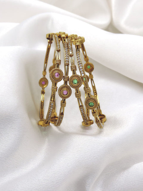 Refined gold-toned multicolor AD bangle set with pink and green stone detailing by joyrias