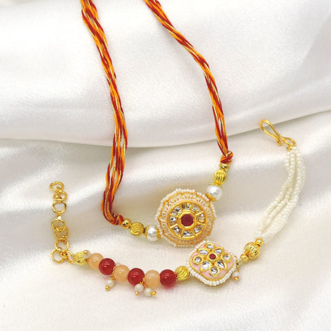 Circular kundan pearl bhaiya bhabhi rakhi set by Joyrias