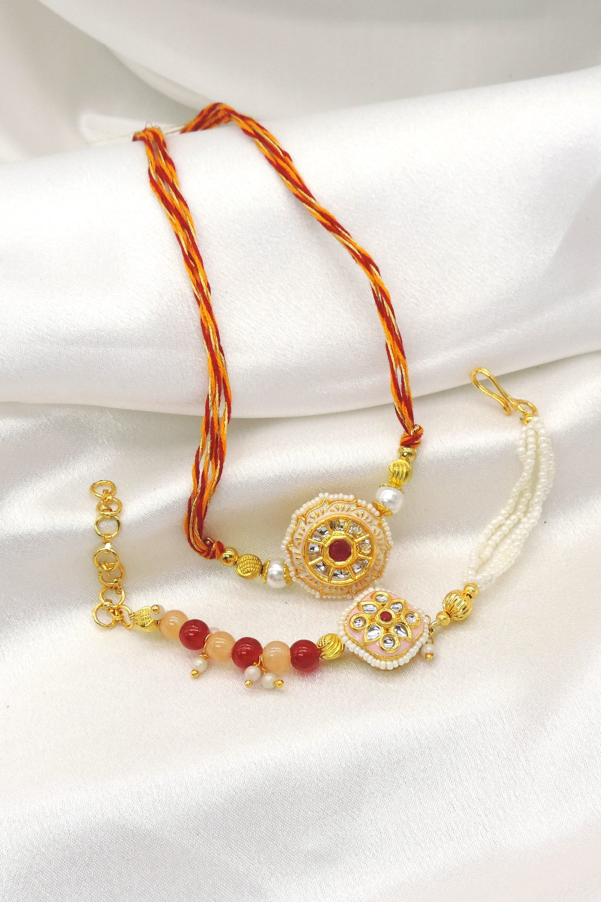 Circular kundan pearl bhaiya bhabhi rakhi set by Joyrias