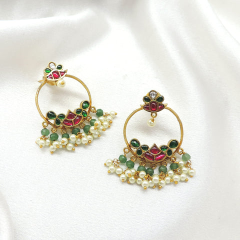 Green pearl temple chandbali earrings with ornate gold tone detailing by joyrias