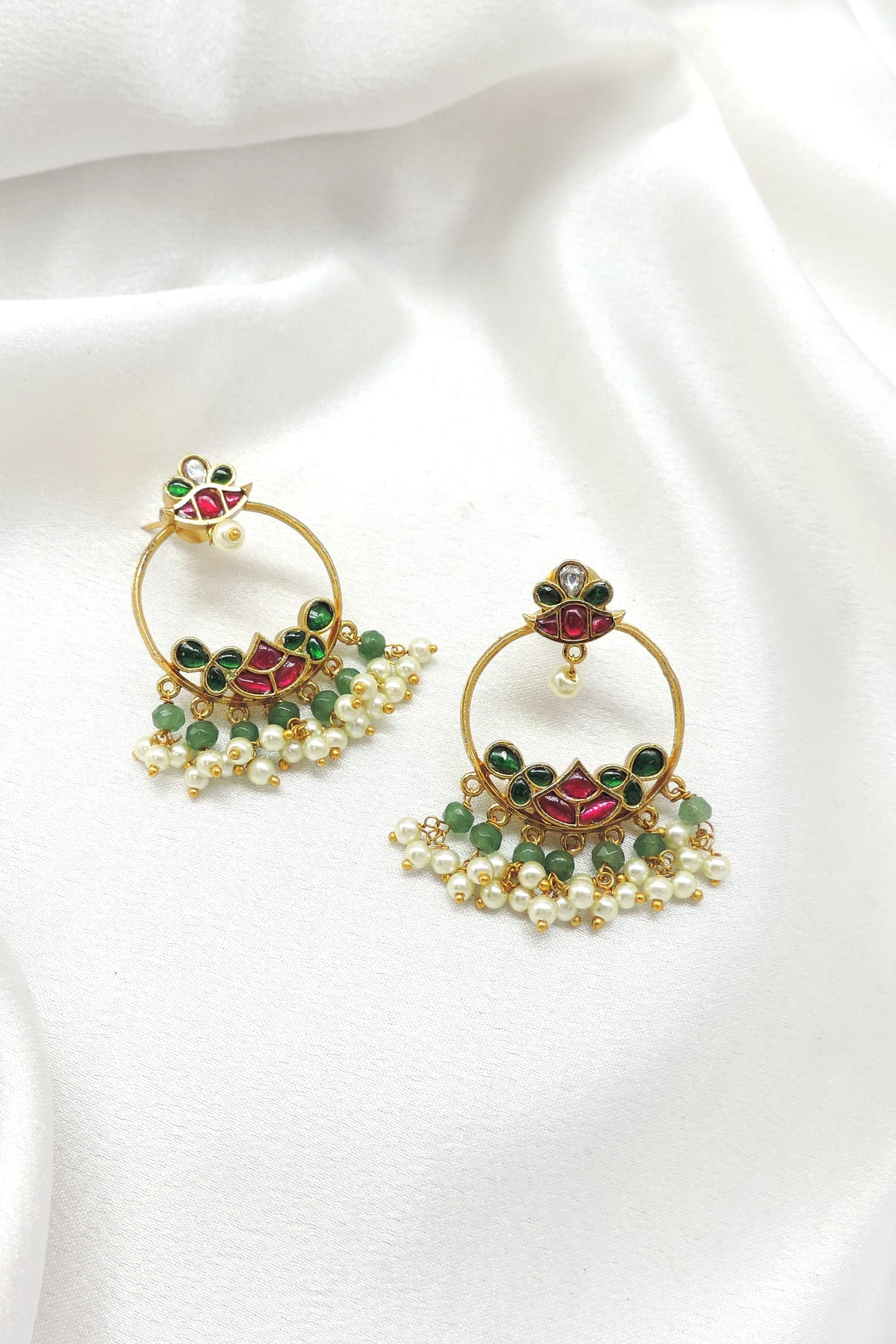 Green pearl temple chandbali earrings with ornate gold tone detailing by joyrias