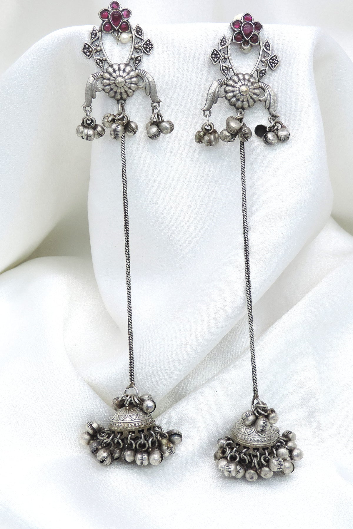 Oxidized silver floral long chain jhumka earrings with ruby-toned detailing by joyrias