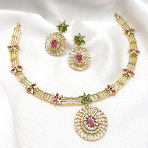 Gold tone sunburst pendant necklace set with pink and green floral accents by joyrias
