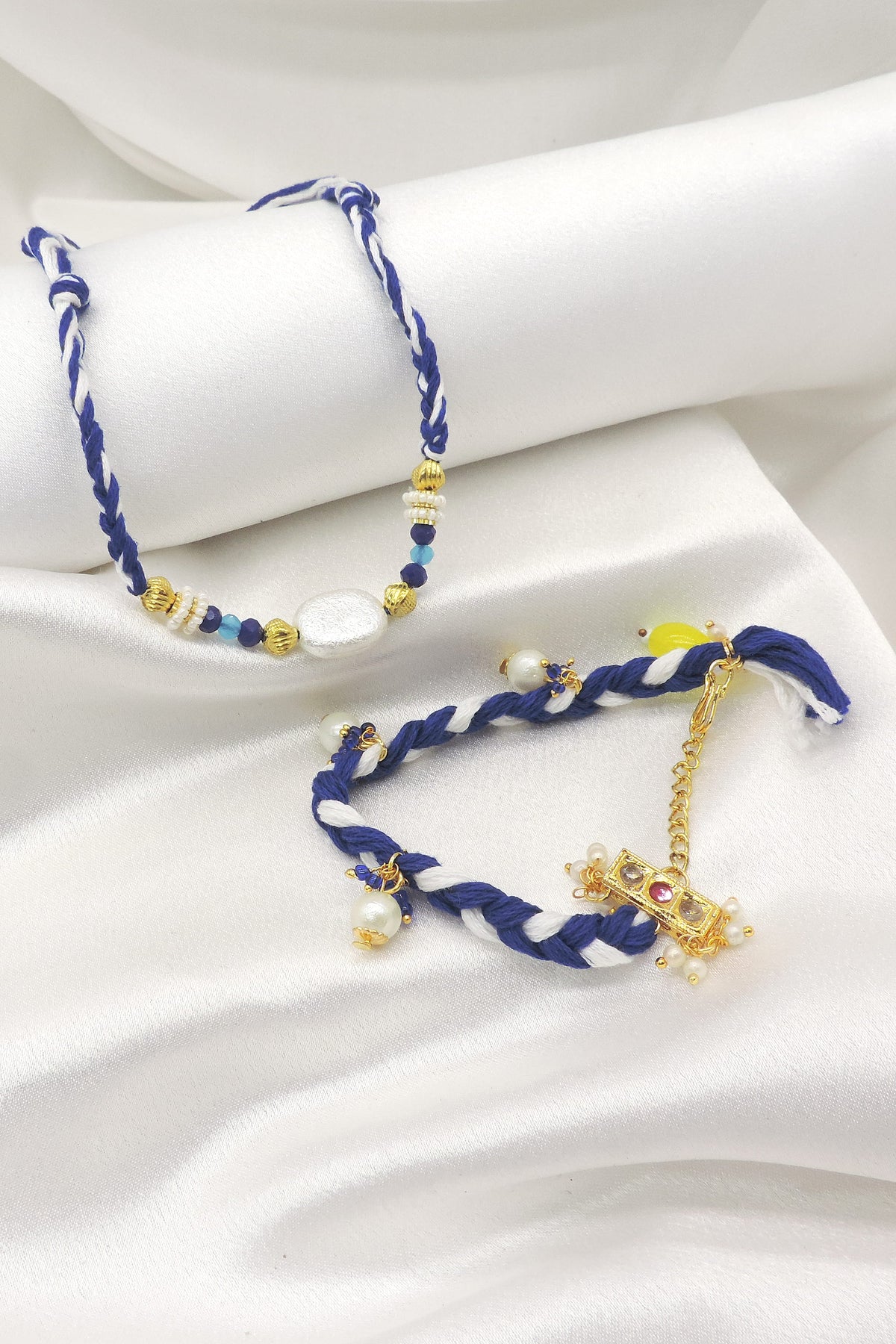 Baroque pearl kundan braided bhaiya bhabhi rakhi set by Joyrias