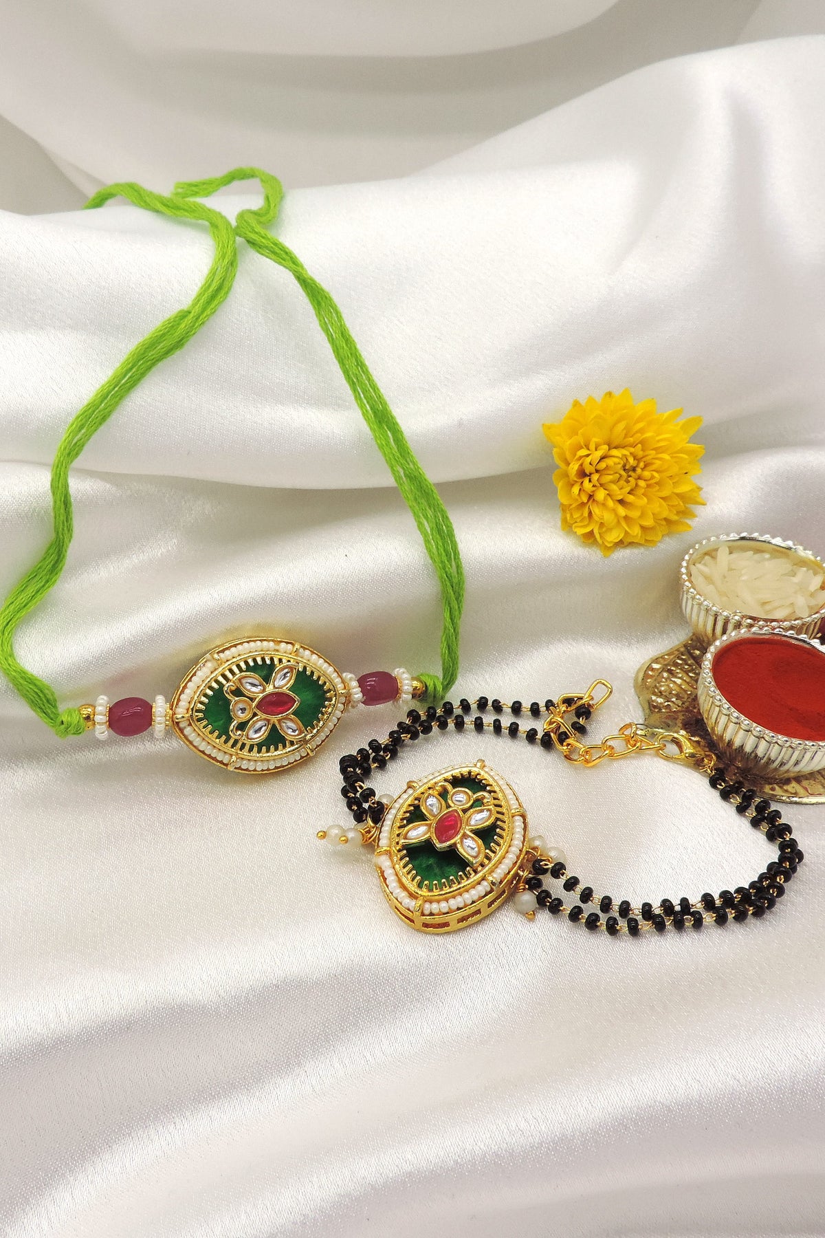 Kundan green enamel pearl bhaiya bhabhi rakhi set by Joyrias