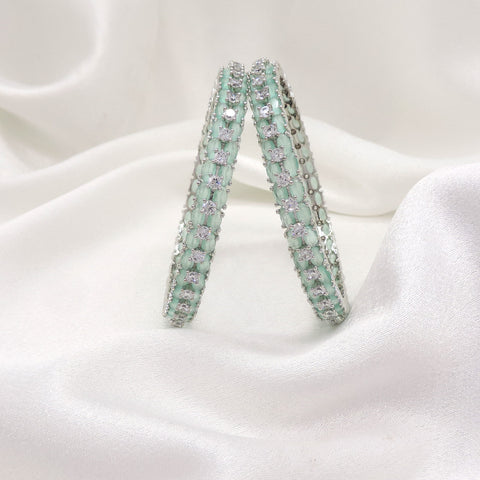 Radiant silver-toned mint green AD floral bangle set by joyrias