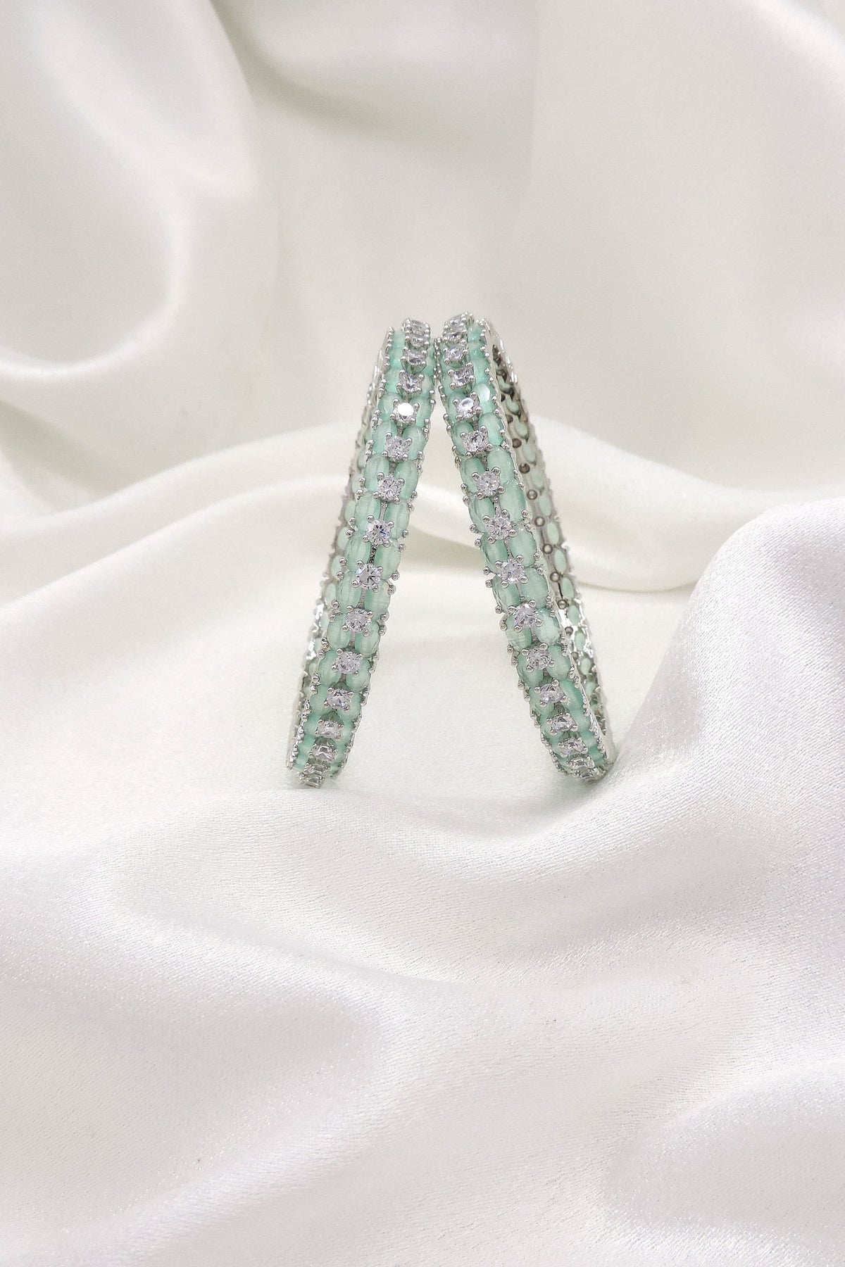 Radiant silver-toned mint green AD floral bangle set by joyrias