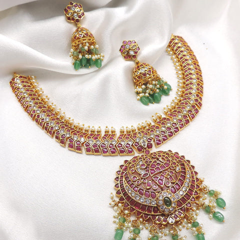 Temple royal gold-toned maroon green kundan necklace set with pearl detailing and matching jhumka earrings by joyrias