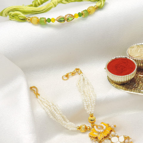 Green crystal kundan pearl bhaiya bhabhi rakhi set by Joyrias