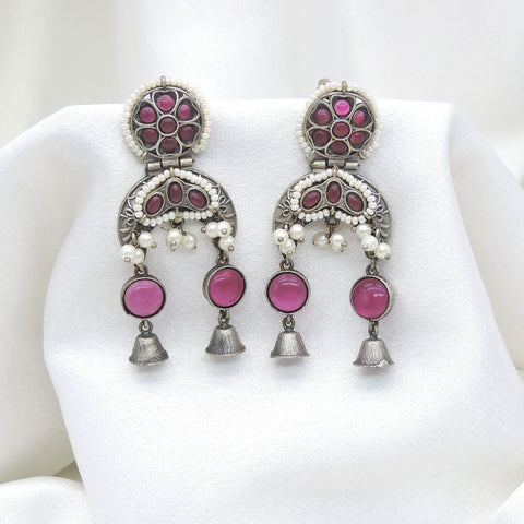 Oxidized silver pink stone double jhumka earrings with pearl detailing and silver bell charms by joyrias