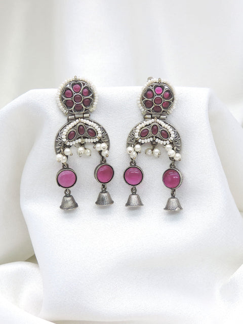 Oxidized silver pink stone double jhumka earrings with pearl detailing and silver bell charms by joyrias