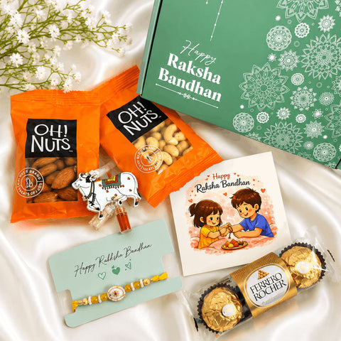 Premium Rakhi gift hamper featuring a designer rakhi, almonds, cashews, Ferrero Rocher chocolates, roli chawal set, greeting card, and festive gift box for Raksha Bandhan celebrations.