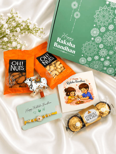 Premium Rakhi gift hamper featuring a designer rakhi, almonds, cashews, Ferrero Rocher chocolates, roli chawal set, greeting card, and festive gift box for Raksha Bandhan celebrations.