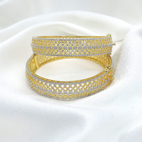 Opulent gold-toned AD wide bangle set with intricate sparkling stone detailing by joyrias