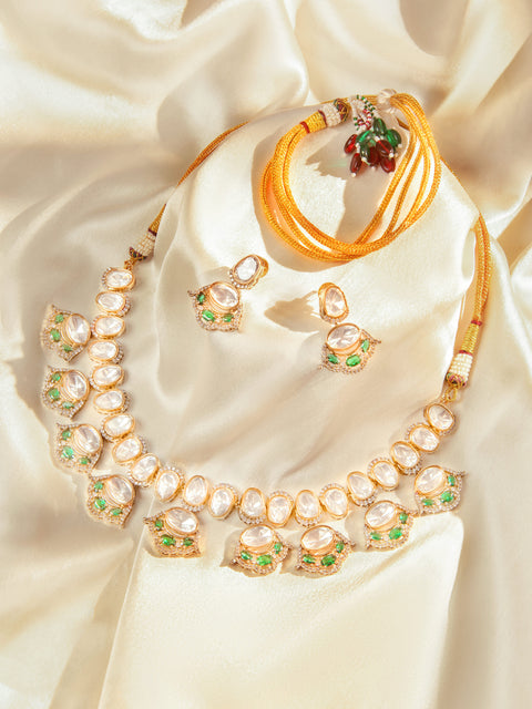 Kundan polki necklace set with green accents and matching earrings