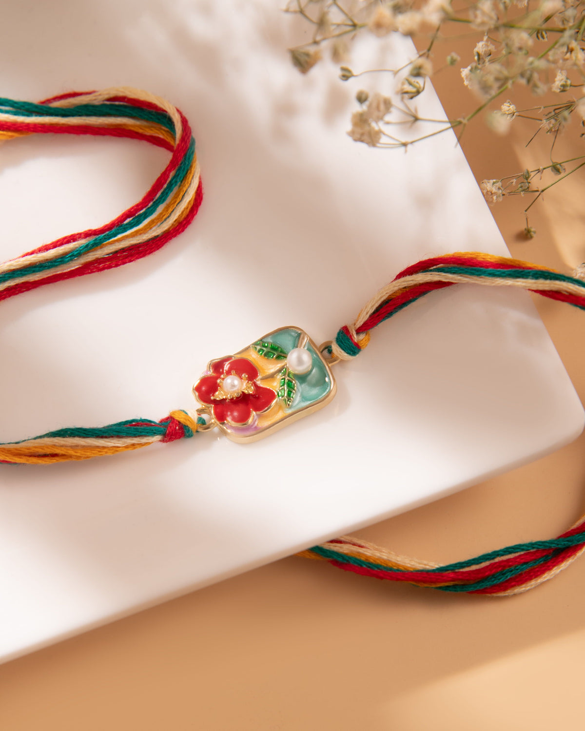 Floral Pearl Bhaiya Rakhi by Joyrias