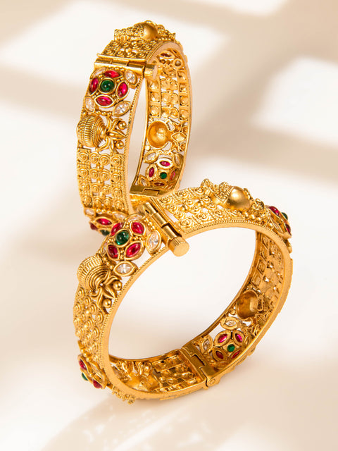 Antique-finish kundan kada bangles set with red, green and clear stone detailing