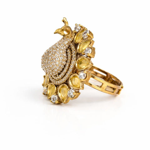 Gold peacock statement ring with yellow stones and crystal detailing