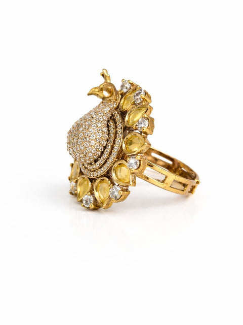 Gold peacock statement ring with yellow stones and crystal detailing