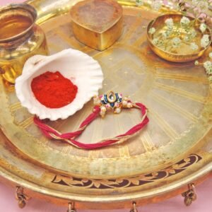 Lotus Kundan Rakhi – Elegant Raksha Bandhan Thread with Pearl Accents