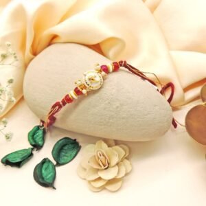 Handcrafted Ganesha Rakhi with Beads & Pearl Accents